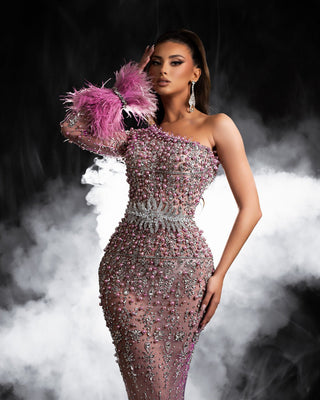 Elegant one-shoulder pink dress adorned with silver crystals, pink beads, and a luxurious lace