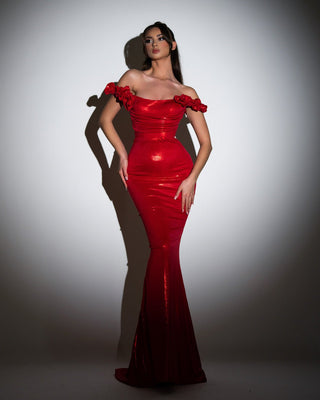 Elegant long red dress with shimmering lace and off-shoulder design.