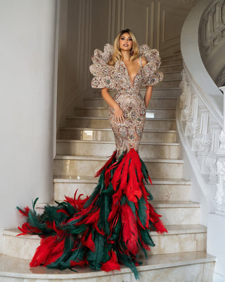 Crystal Dress in luxury lace adorned with red and green crystals, featuring a regal design from bust to back and a feathered flourish from the knees.