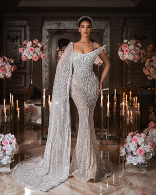 Luxurious bridal gown adorned with pearls and sparkling fabric