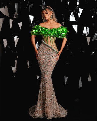 Exquisite green dress adorned with silver and green crystals.