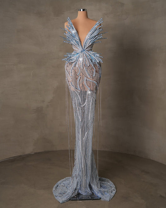 Model in the Aera Long Dress with colorful butterfly design.






