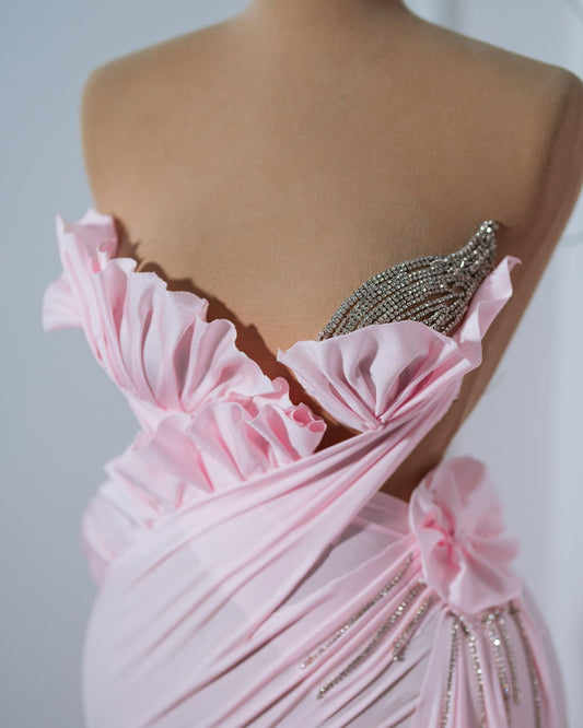 Breast cancer awareness-inspired Aisyah Pink Dress, featuring soft pink tones and a sophisticated handmade flower design, embodying grace and empowerment.