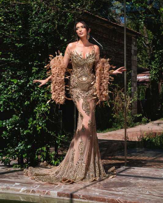 Elegant sleeveless dress with crystal embellishments.
