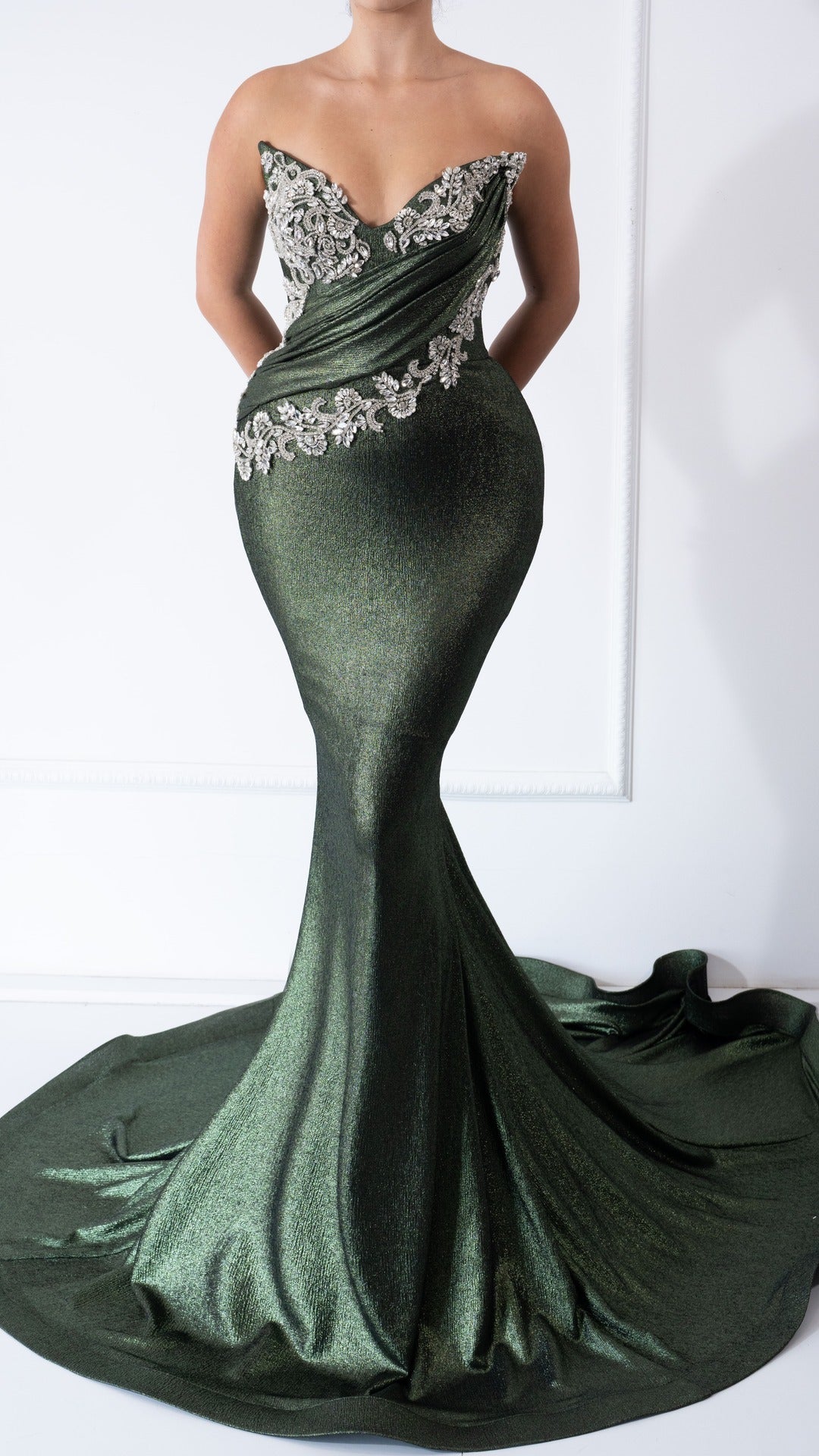 Elegant Alissa green dress with crystal embellishments, featuring a flattering silhouette and sparkling details.