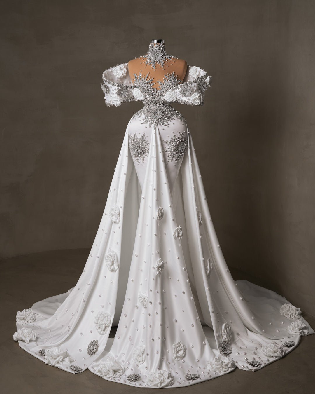 Long white satin bridal dress with overskirt, embellished with 3D floral details