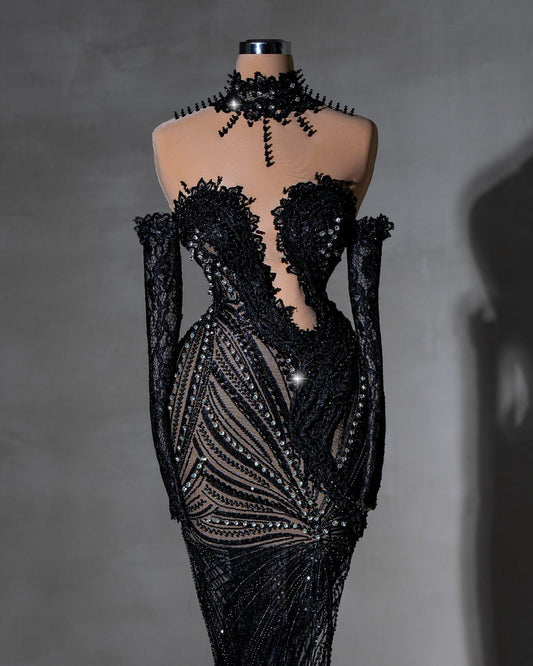 Elegant black lace gown with crystal details and high collar.