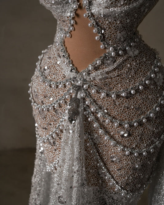 Close-up of hot bridal dress with intricate sequin and pearl detailing