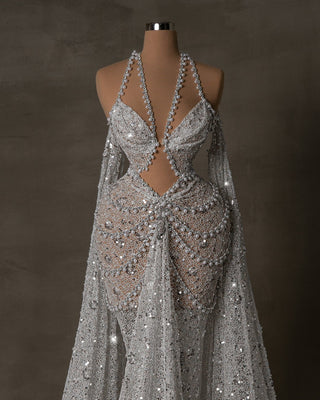 Front view of a hot bridal dress with sparkling sequins and pearls