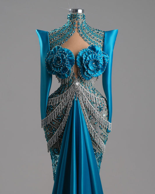 Teal-blue satin gown with silver beading and floral details.