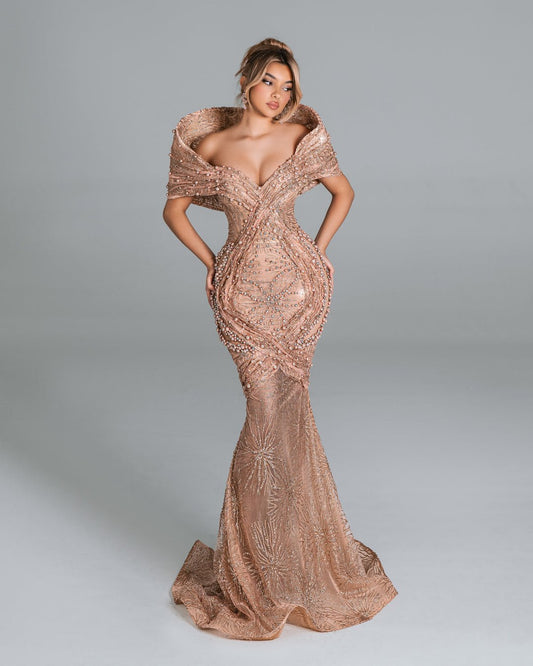 Elegant off-shoulder gown with pearl detailing.
