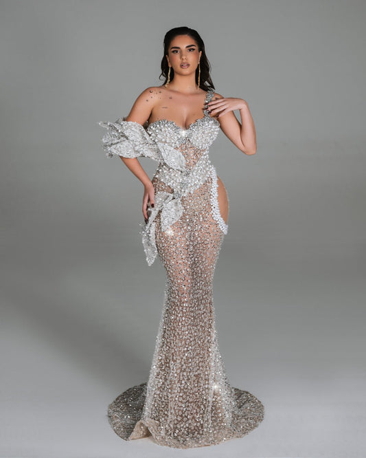 Elegant sheer gown with crystal floral embellishments.
