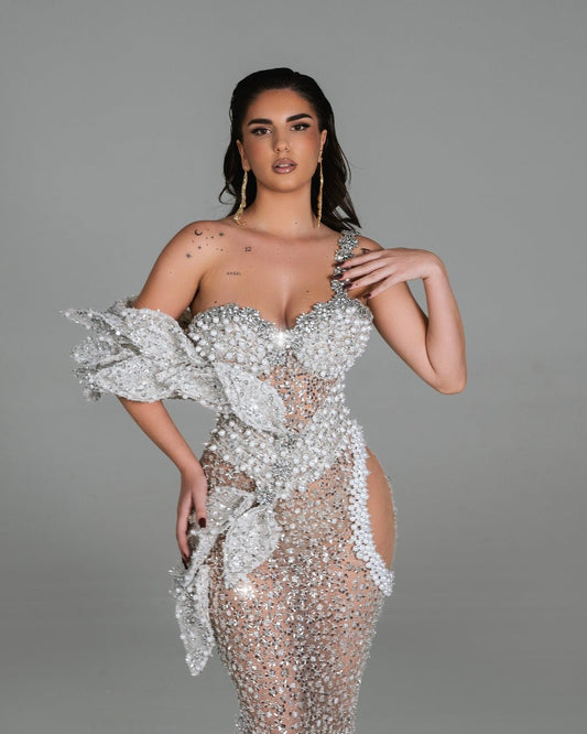 Floor-length dress featuring shimmering crystals and sculpted flowers