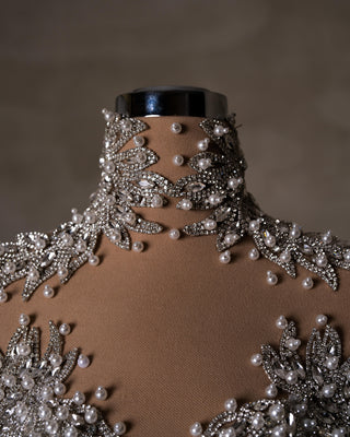 Crystals and Pearls Adorning the Neck of the Bridal Gown
