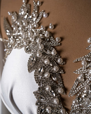 Crystal and Pearl Embellishments on the Bust of the White Satin Bridal Dress