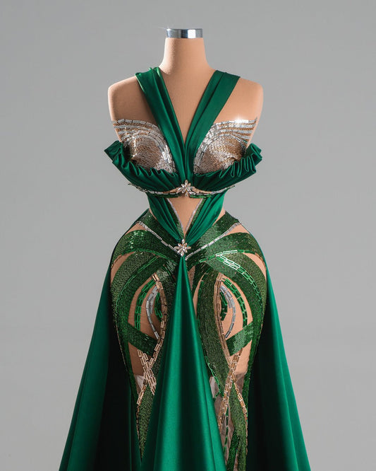 Emerald green gown with crystal details and plunging neckline.