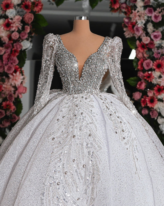 Close-up of the Eden Bridal Dress, featuring delicate crystal embellishments on a fitted bodice and voluminous skirt.