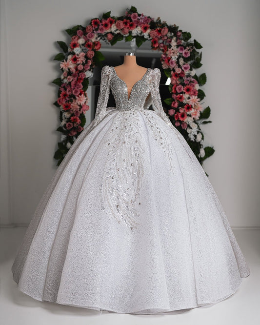 Eden Bridal Dress adorned with shimmering crystals and flowing sheer layers, perfect for an elegant bridal look.