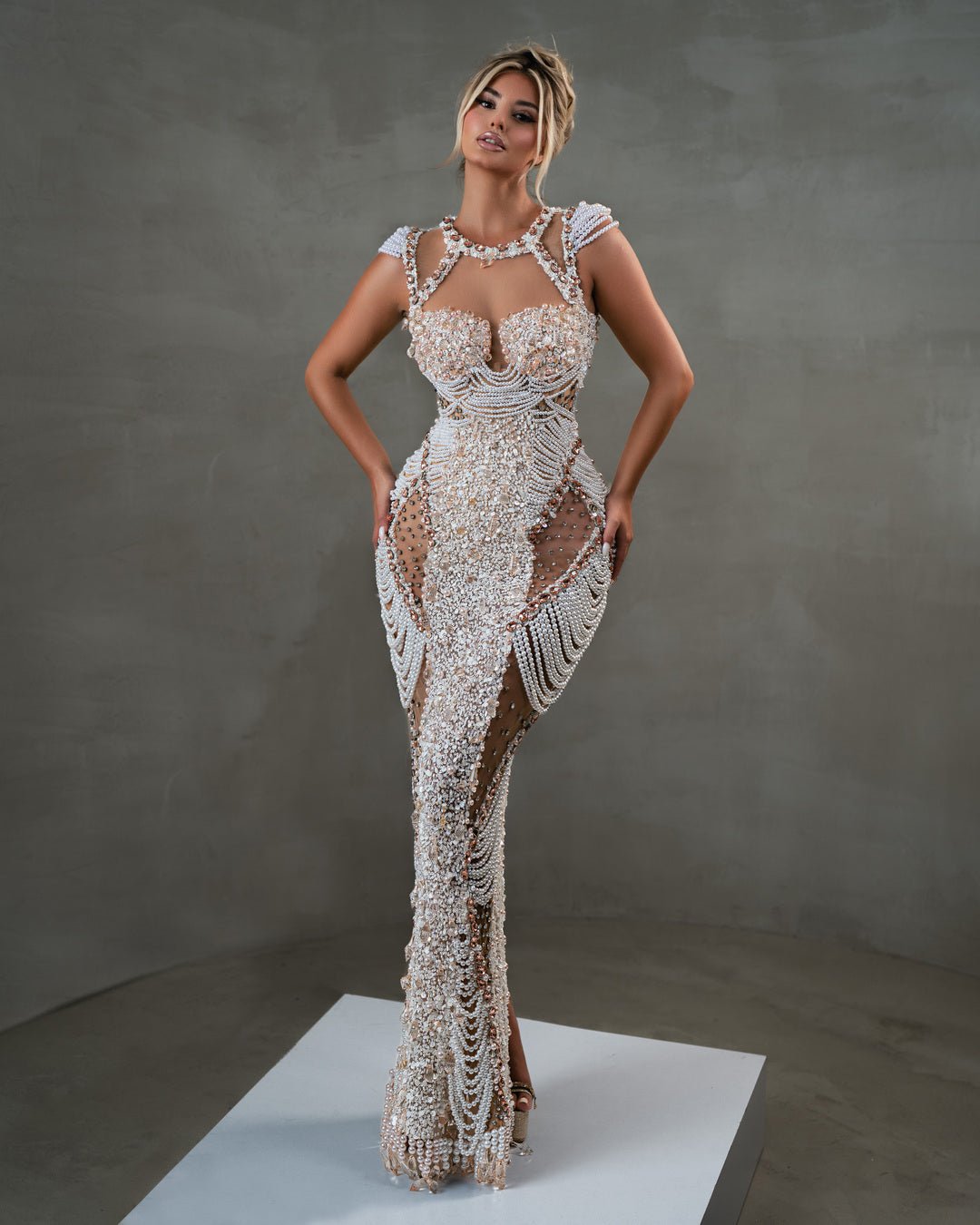 White sequin dress with modern cutouts and pearl details