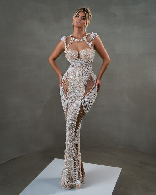 White sequin dress with modern cutouts and pearl details