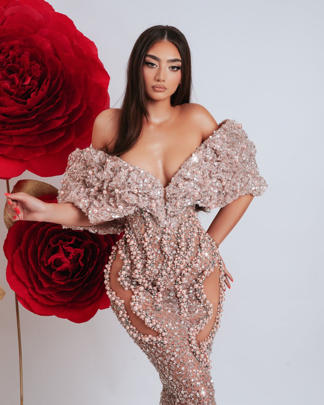 Luxury off shoulder gown adorned with light pink beads and leg cut-outs.