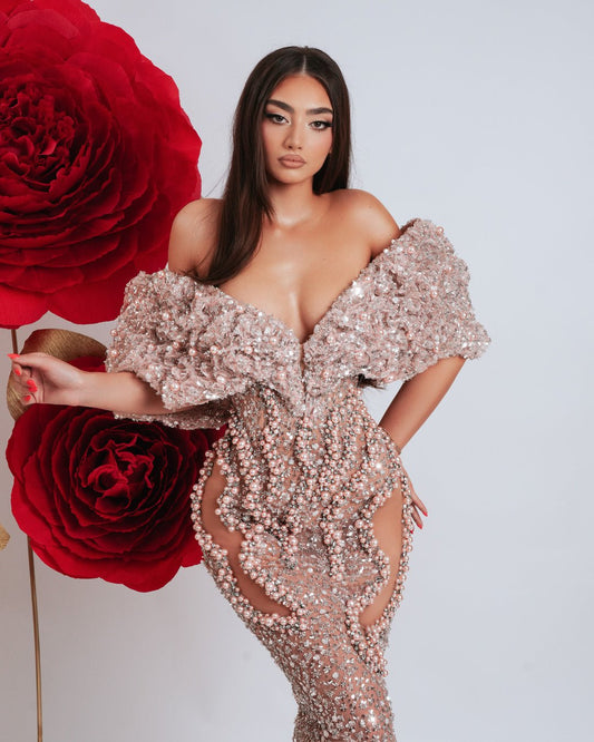 Luxury off shoulder gown adorned with light pink beads and leg cut-outs.
