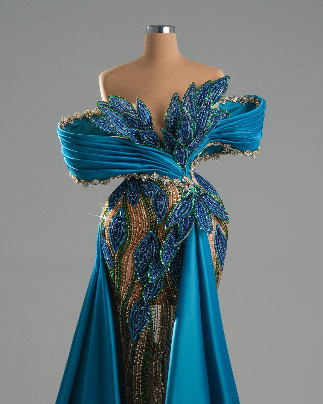 Elegant draped blue gown.