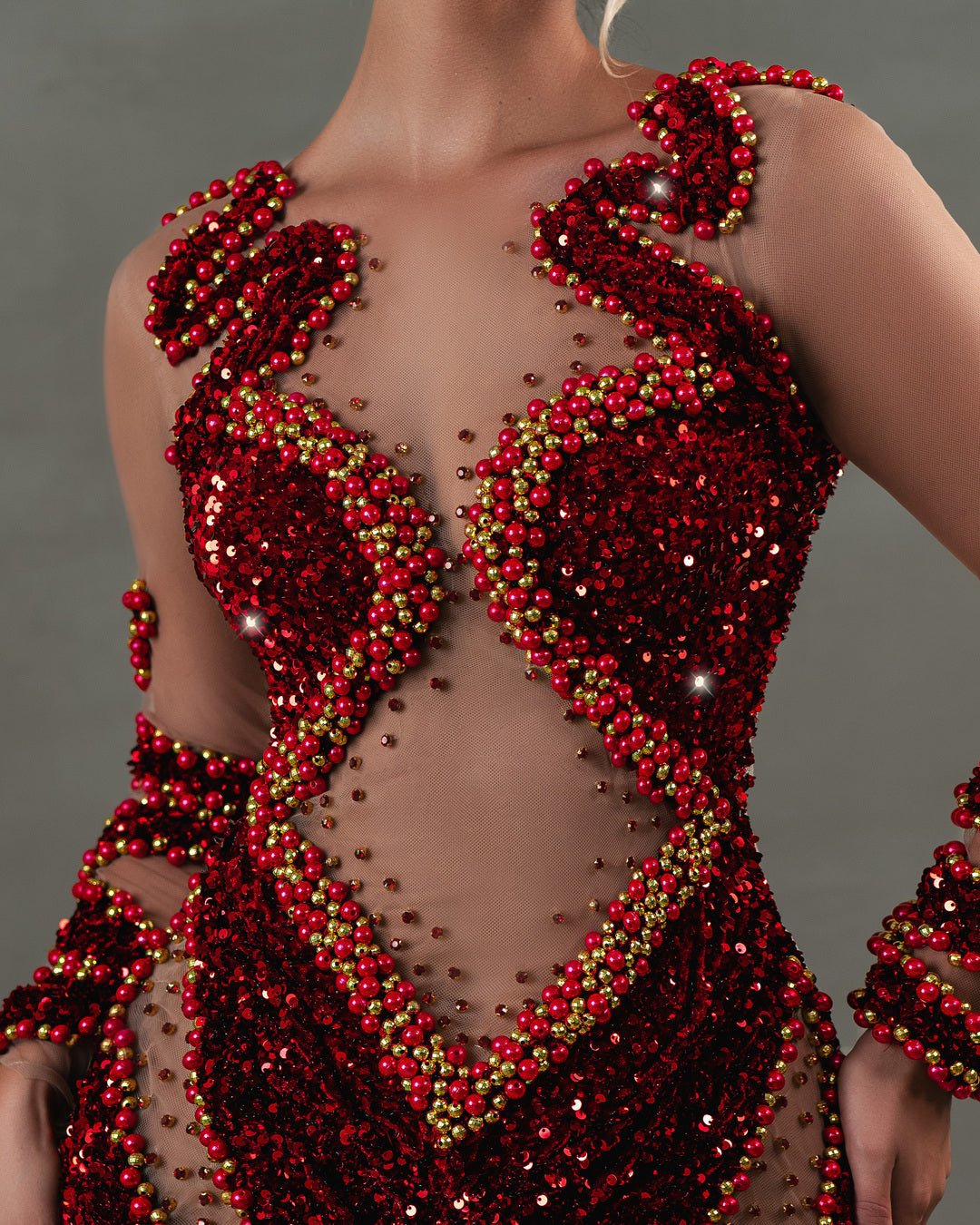 Close-up of bead embellishments on red dress