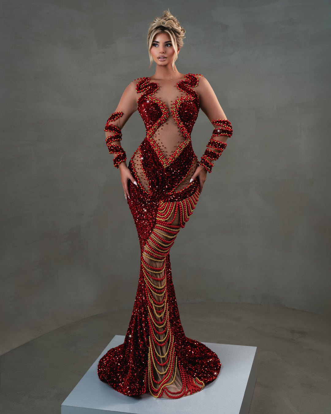 Elegant red dress with sequin fabric and cut-out details