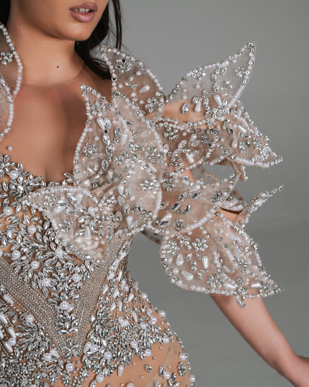 Statement nude dress with shimmering fringe.