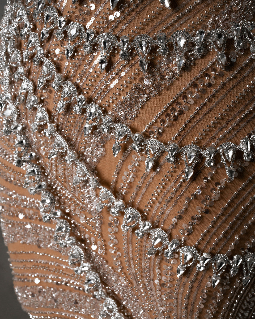 Closeup of intricate crystal and sequin embellishments on Off Shoulder Dress