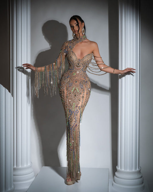 Elegant long gold dress with asymmetrical neckline, one-shoulder design, and crystal embellishments