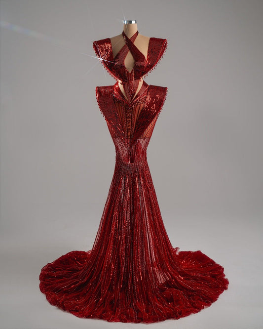 Sculptural gown with halter neckline and cutouts.