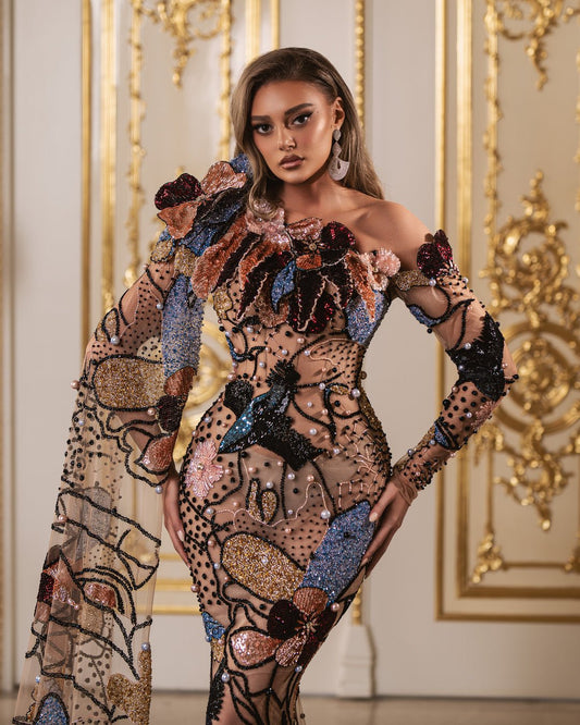 Luxurious dress adorned with colorful feathers and sparkling beads