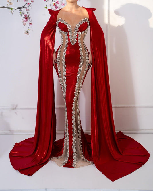 Elegant red dress with long sleeves and sparkling crystal embellishments.