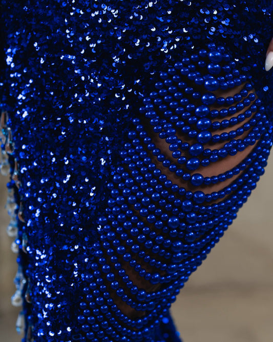Detailed View of Sequin Fabric and Beadwork on Blue Dress