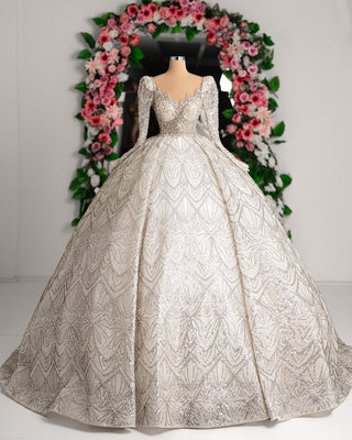 Luxurious bridal gown featuring intricate lace, shimmering sequins, and long sleeves.