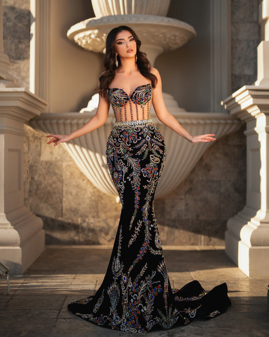 Glamorous mermaid gown with metallic accents and bold sleeves.