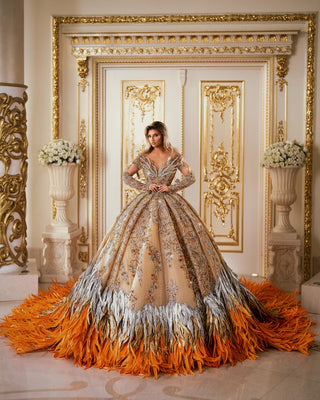 Luxurious Long Sleeve Orange Gown with Feather Accents