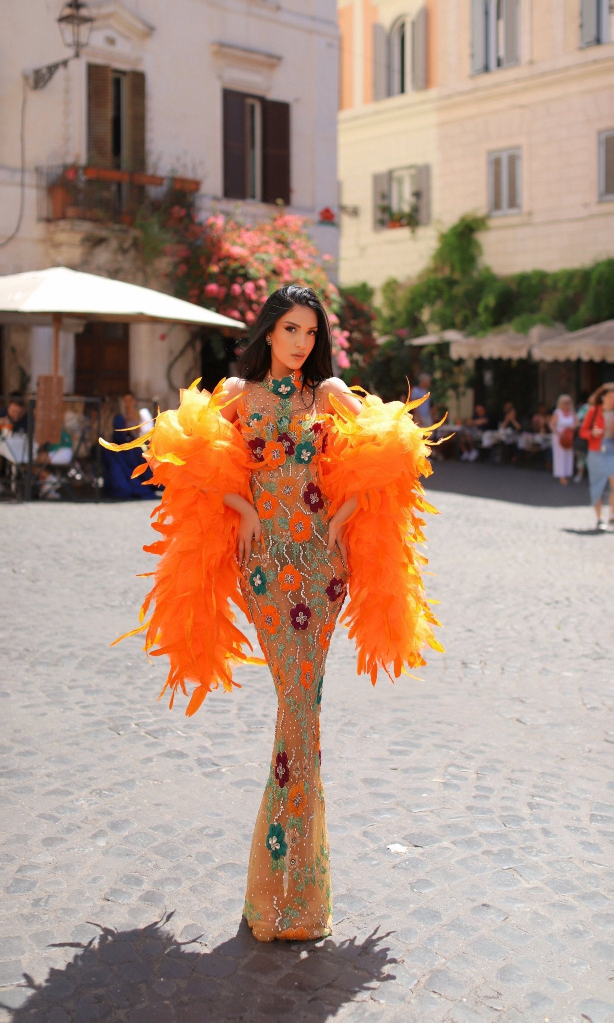 High neck orange dress embellished with stones and green flowers