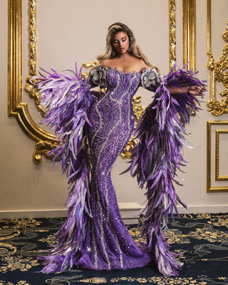 Off-the-shoulder purple gown with regal feathered sleeves