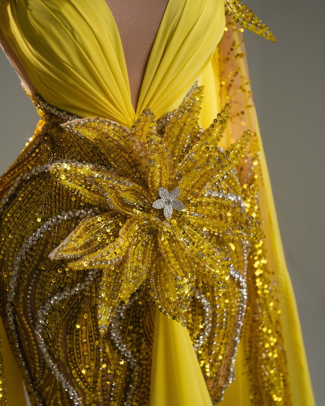 Handmade yellow gown with crystals, flowers, and flowing cape.