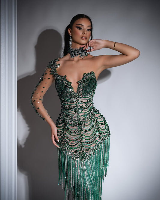 Stylish green dress featuring silver tassels and green bead embellishments.