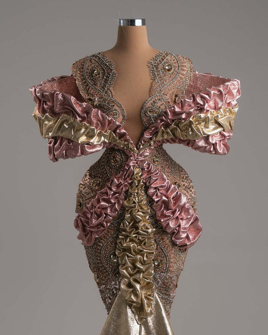 Pink and gold ruffled mini dress with a shimmering gold skirt.