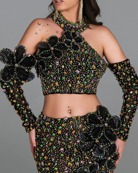 Sophisticated black dress with shimmering floral patterns and bold 3D appliqués.