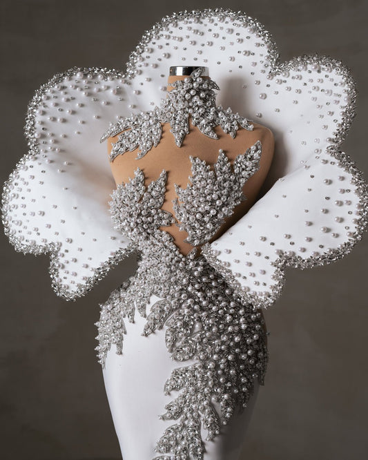 Close-up of bridal dress neckline with crystals and pearls