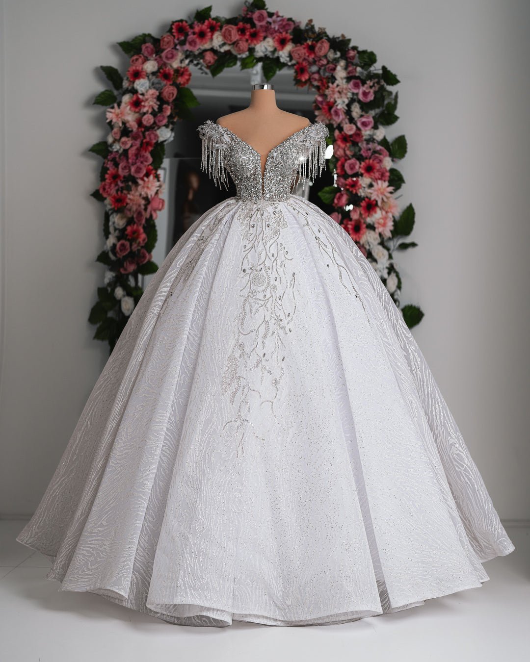 Roselyn Off Shoulder Bridal Dress with crystal embellishments, featuring a flowing skirt and elegant neckline.