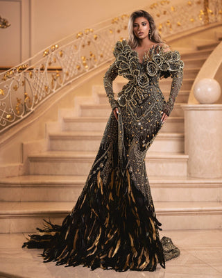 Elegant black dress with off-shoulder design and gold embellishments
