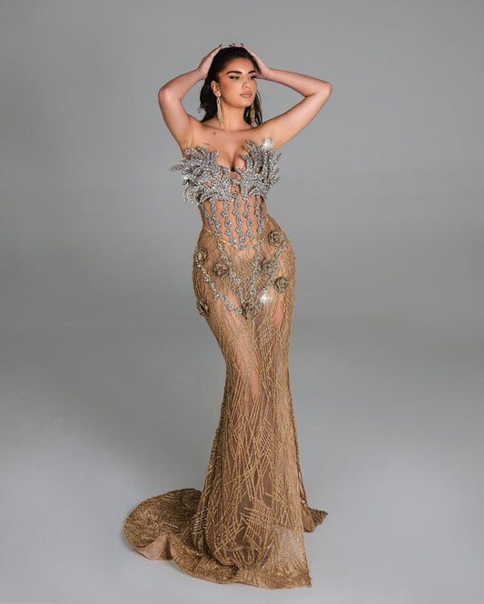 Sheer gown with intricate gold embroidery and 3D floral details.