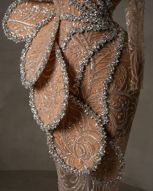 Close-up of sparkling crystals on a one shoulder dress